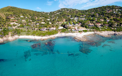 Summer holidays on French Riviera, aerial view on rocks and sandy beach Escalet with crystal clear blue water near Ramatuelle and Saint-Tropez, Var, France
